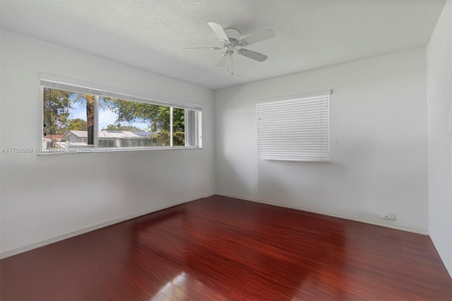 unfurnished room featuring ceiling fan and wood finished floors