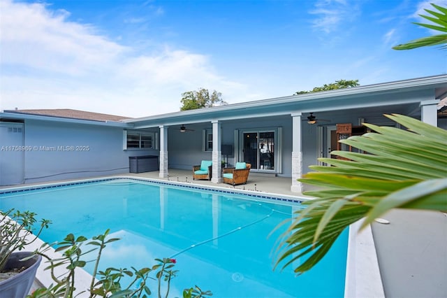 pool featuring a patio area and a ceiling fan