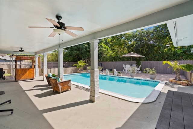 view of pool with a patio area, a fenced in pool, a ceiling fan, and a fenced backyard