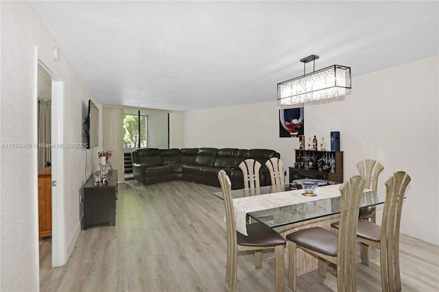 dining space with light wood-type flooring