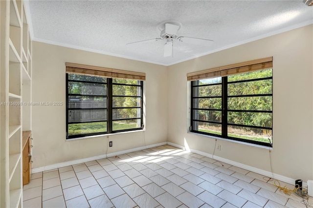 unfurnished room with crown molding, a ceiling fan, baseboards, and a textured ceiling