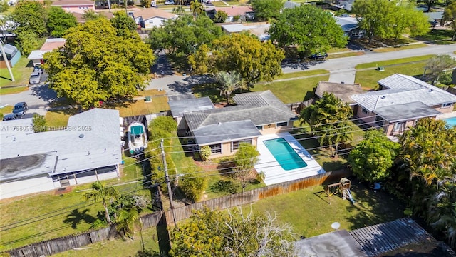 birds eye view of property with a residential view