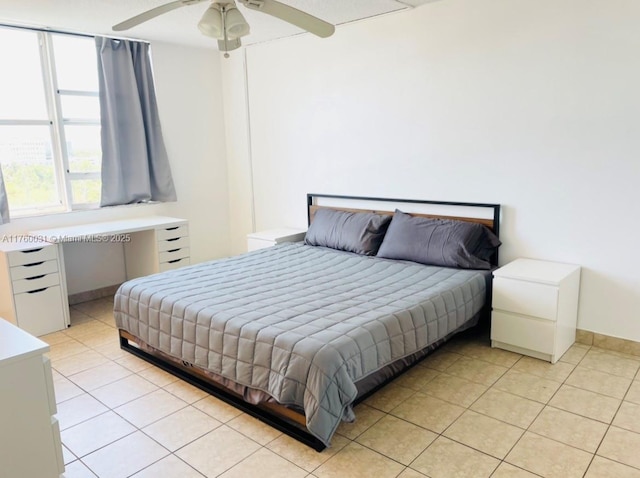 bedroom with light tile patterned flooring and ceiling fan