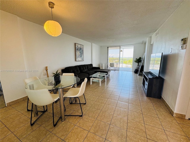 3660 NE 166th St Unit 812, North Miami Beach, FL 33160 - dining space featuring a textured ceiling and light tile patterned flooring