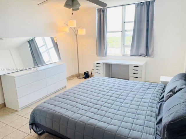 bedroom featuring tile patterned flooring and baseboards