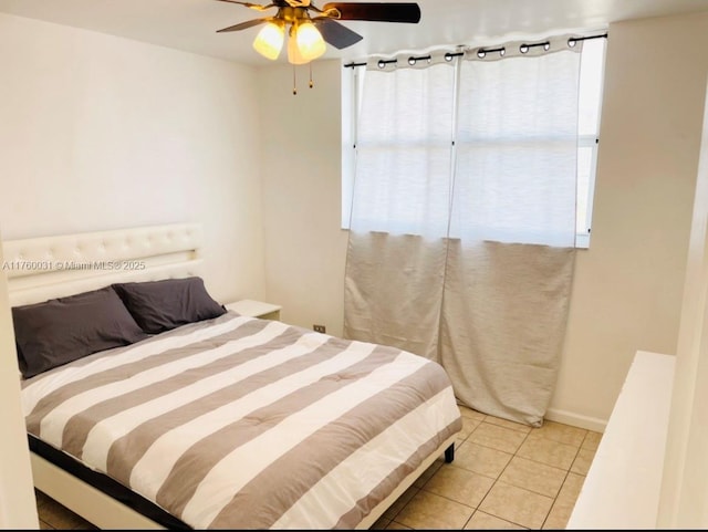 bedroom featuring light tile patterned flooring and a ceiling fan