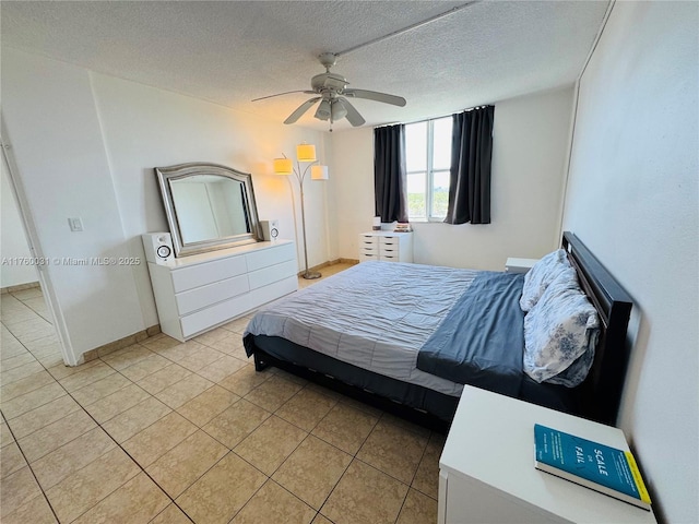 3660 NE 166th St Unit 812, North Miami Beach, FL 33160 - bedroom featuring a textured ceiling, light tile patterned floors, a ceiling fan, and baseboards