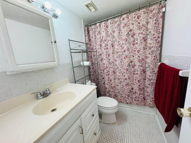 3660 NE 166th St Unit 812, North Miami Beach, FL 33160 - bathroom with toilet, vanity, tile walls, tile patterned flooring, and shower / bathtub combination with curtain