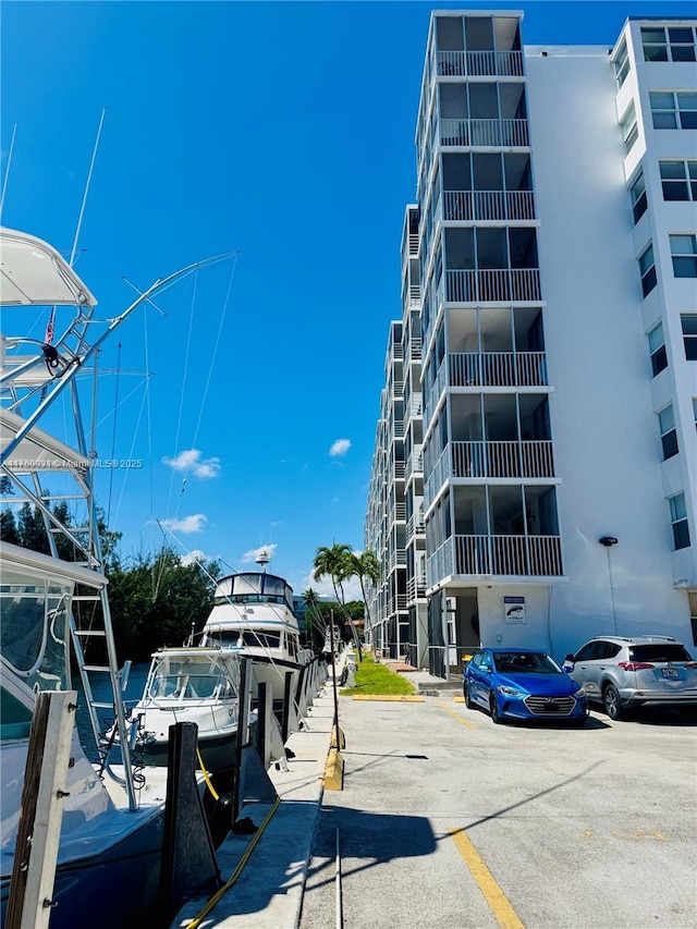 view of property featuring uncovered parking