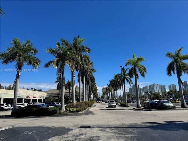 3660 NE 166th St Unit 812, North Miami Beach, FL 33160 - view of asphalt street with curbs and street lights