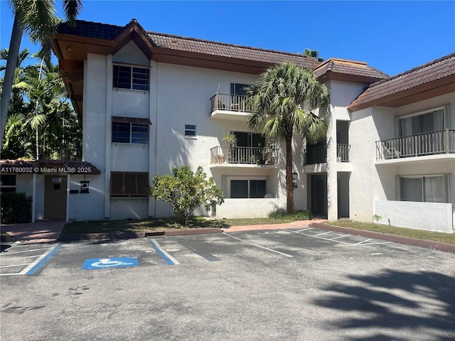 view of property with uncovered parking