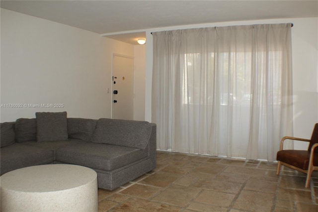 living area with stone tile flooring