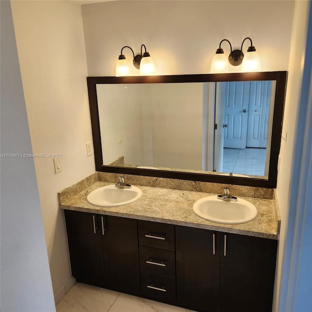 bathroom with a sink and double vanity