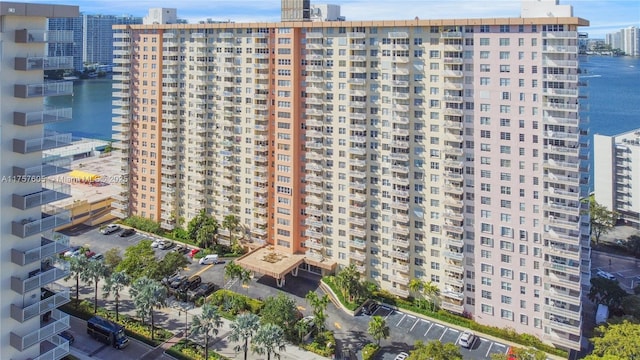 view of building exterior featuring a view of city and a water view