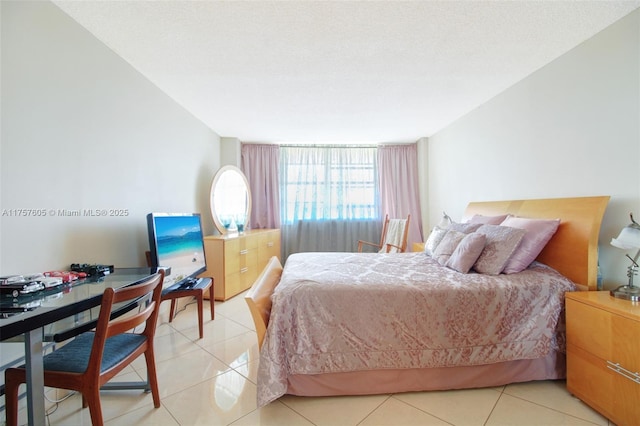 bedroom featuring light tile patterned floors