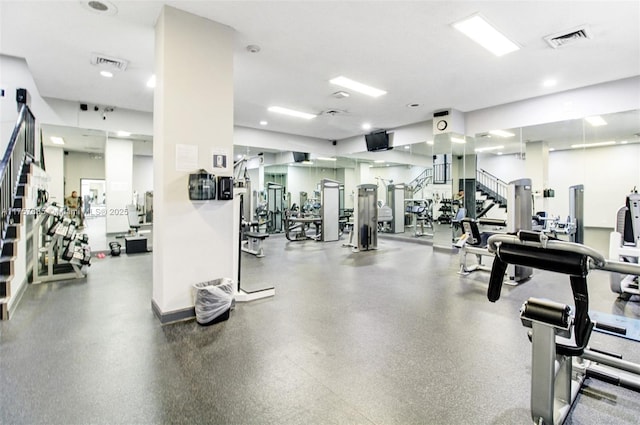 exercise room featuring visible vents