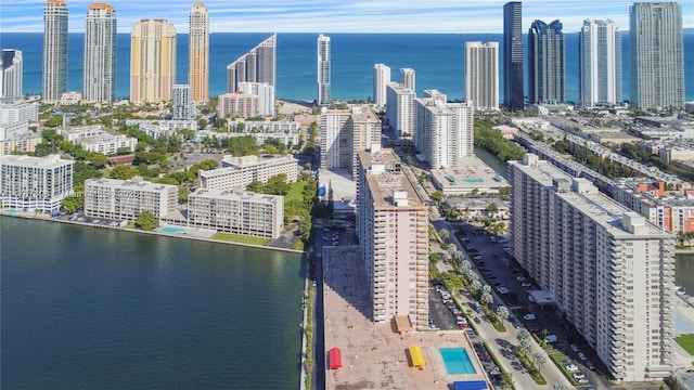 aerial view featuring a city view and a water view