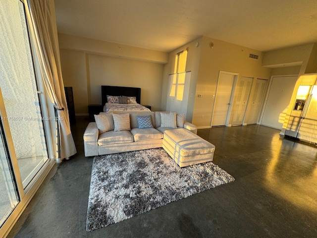 bedroom featuring visible vents and concrete flooring