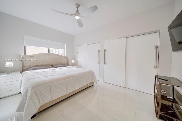 bedroom featuring two closets and a ceiling fan