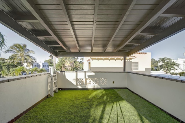 view of yard with a balcony