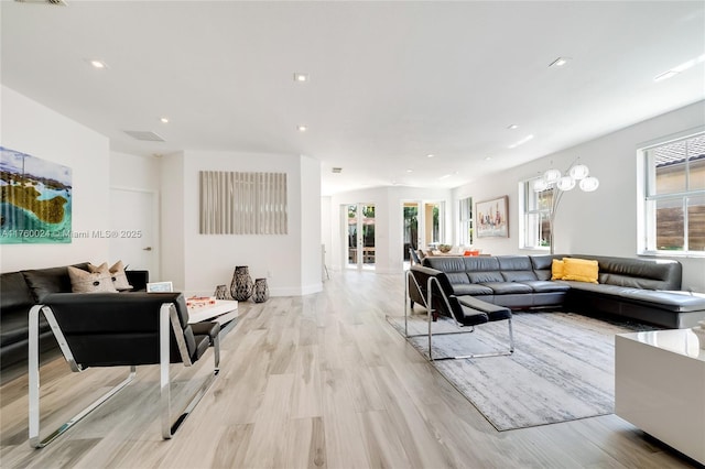 living room featuring light wood finished floors and recessed lighting