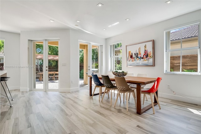 dining space featuring light wood-type flooring, french doors, baseboards, and recessed lighting