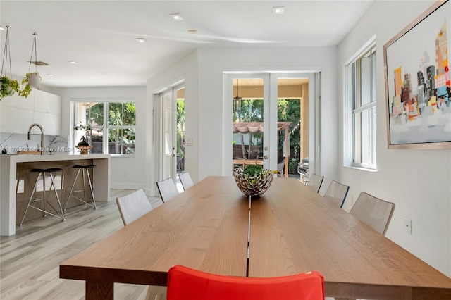 dining room with light wood-type flooring