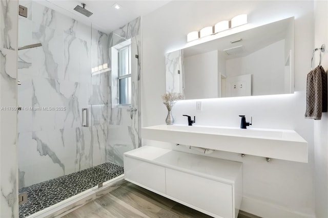 full bathroom featuring a marble finish shower