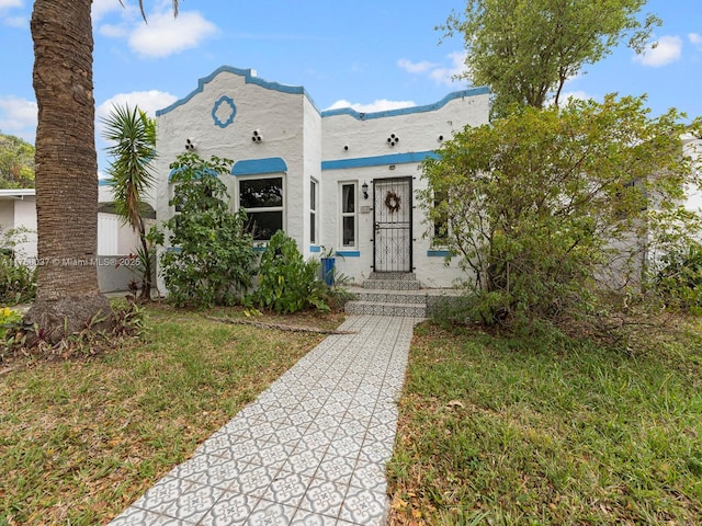 view of front of house featuring stucco siding