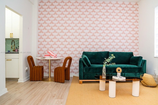 living room featuring wood finished floors and baseboards