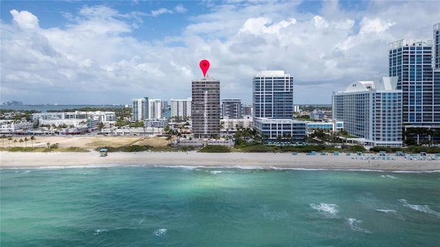 aerial view with a view of city, a view of the beach, and a water view