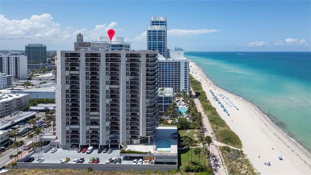 aerial view with a view of city, a view of the beach, and a water view