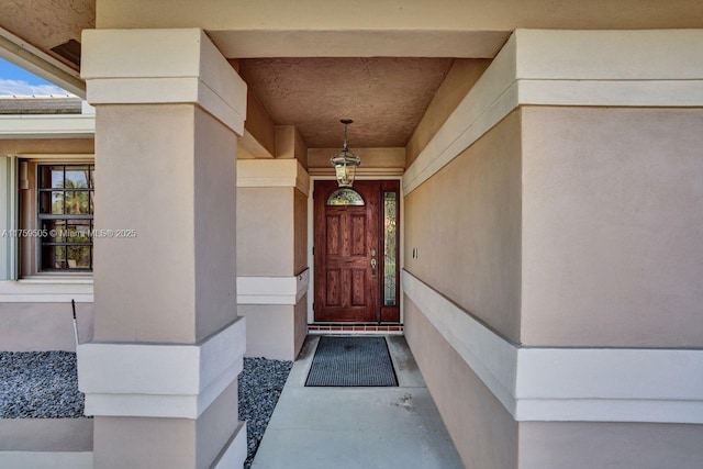 doorway to property with stucco siding