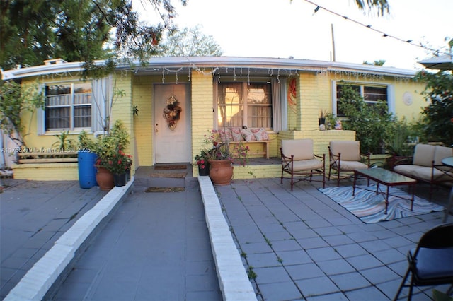 exterior space with brick siding