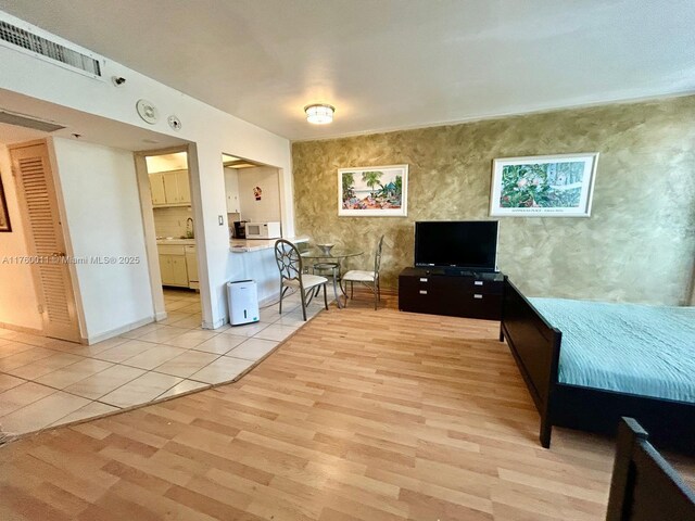 100 Lincoln Rd Unit 329, Miami Beach, FL 33139 - living area with light wood-type flooring and baseboards