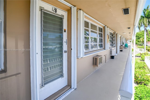 view of patio featuring a wall mounted air conditioner