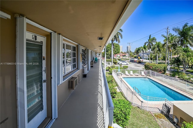 community pool featuring fence