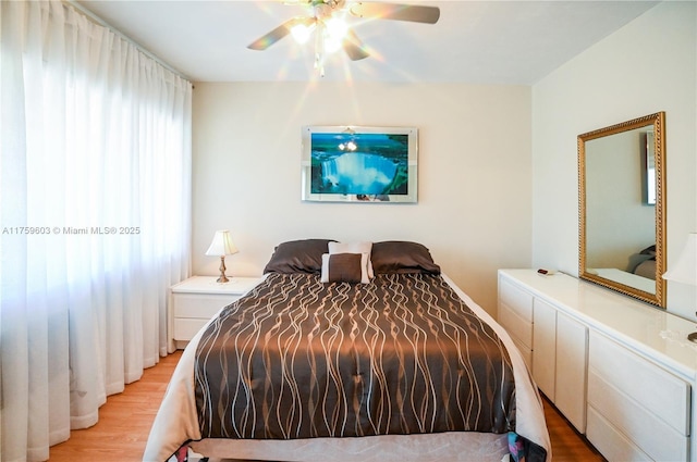 bedroom featuring light wood-type flooring and ceiling fan