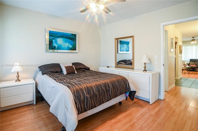 bedroom with light wood-style flooring and ceiling fan