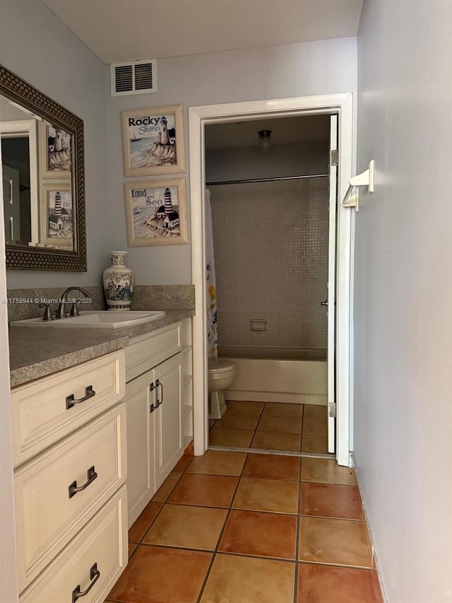 full bathroom with visible vents, toilet, shower / bath combo with shower curtain, tile patterned floors, and vanity