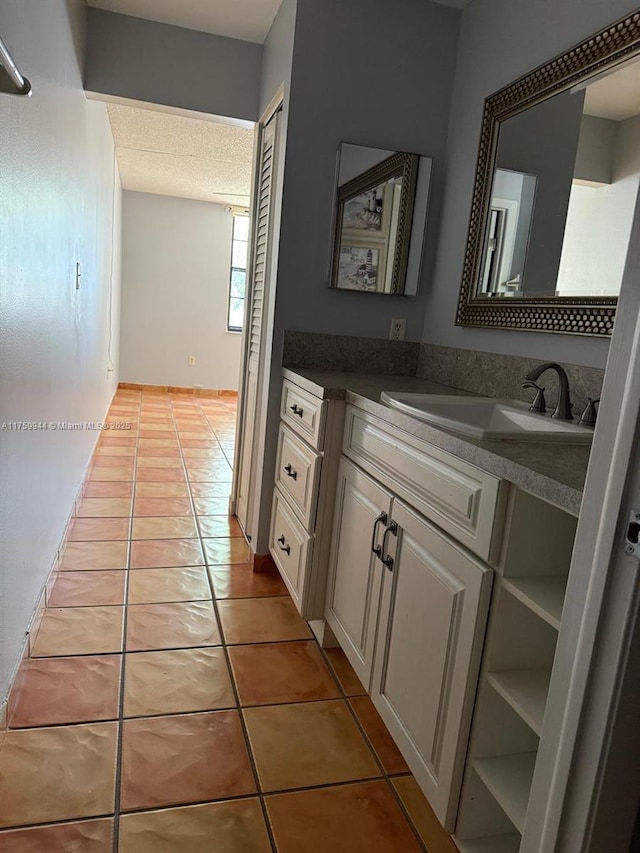 bathroom featuring tile patterned floors and vanity