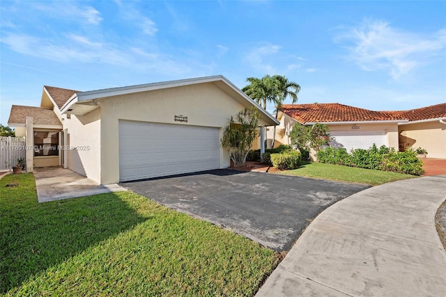 view of front of home with a front lawn, driveway, and stucco siding