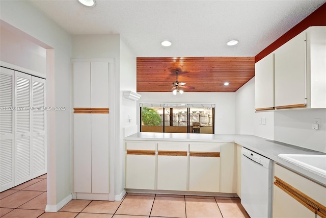 kitchen featuring light tile patterned floors, dishwasher, recessed lighting, and light countertops