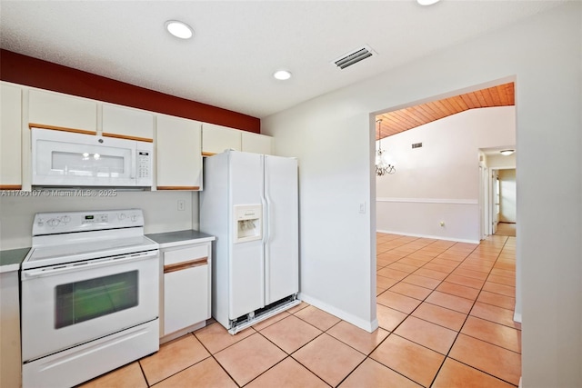 kitchen featuring visible vents, recessed lighting, light tile patterned flooring, white cabinets, and white appliances