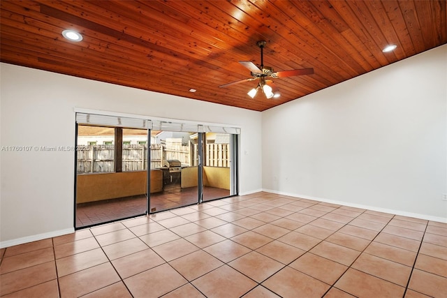 empty room with light tile patterned floors, baseboards, wood ceiling, and recessed lighting