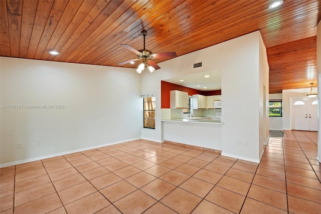 interior space with light tile patterned floors, visible vents, recessed lighting, and baseboards