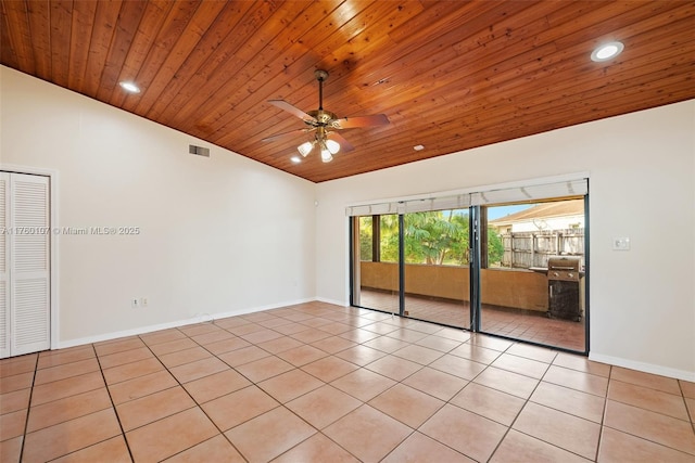 unfurnished room with visible vents, light tile patterned flooring, wooden ceiling, and vaulted ceiling