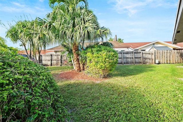 view of yard with a fenced backyard