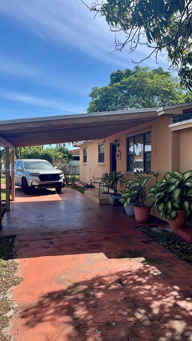 exterior space featuring concrete driveway