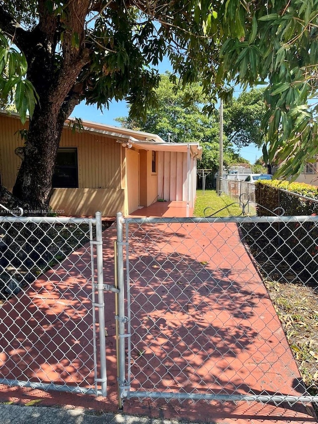 view of gate featuring fence